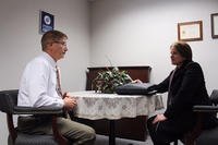 National Background Investigation Bureau Special Agent Josephine Dow meets with Jim Mitchell, 88th Air Base Wing Public Affairs operations chief, to finalize his personnel security investigation, Nov. 8, 2017. (U.S. Air Force photo/Stacey Geiger)