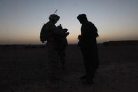 A Marine speaks to a village elder in Afghanistan. The Corps is looking for Marines to help build up a new psychological operations military occupational specialty. (Cpl. Skyler Tooker/U.S. Marine Corps)