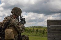 Marine fires an M320 grenade launcher module