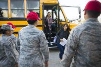 students getting off bus