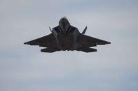 An F-22 Raptor flies over the runway Nov. 30, 2017, at Eglin Air Force Base, Fla.