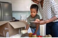 Mtoher and son with meal box