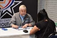 woman and man sitting at table for interview