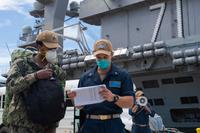 U.S. Navy is checked into the aircraft carrier USS Theodore Roosevelt (CVN 71) May 16, 2020, after completing off-base quarantine.