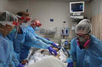 medical care to a COVID-19 patient
