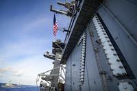 The Theodore Roosevelt Carrier Strike Group transits the Philippine Sea.