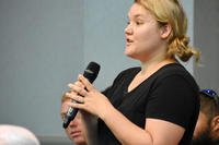 woman speaking into a microphone