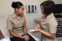 Lt. Tasha Gallegos talks to a female service member about contraceptive care.