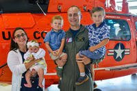 family standing in front of helicopter