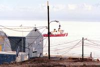 McMurdo Station in Antarctica with the Coast Guard icebreaker Polar Star in the background.