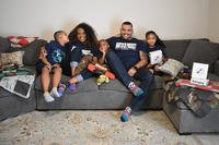 army family sitting on couch