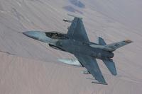 An F-16 Fighting Falcon pulls away from a KC-135 Stratotanker.