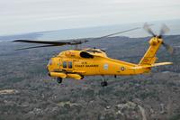 A Coast Guard MH-60 Jayhawk helicopter rescue crew flies over Cape Cod, Massachusetts.