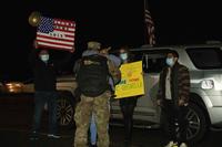 A National Guard member hugs a family member after a yearlong deployment. 