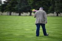 A Vietnam veteran looks for a grave at the at the Oregon Trail State Veterans Cemetery