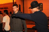 A Coast Guard company commander instructs a new recruit