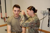 Soldier examined during morning sick call