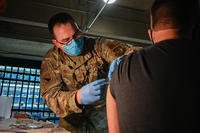 Air Force technical sergeant administers COVID-19 vaccine