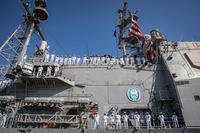 Sailors assigned to the guided-missile cruiser USS Philippine Sea (CG 58) man the rails