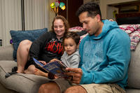 family reads a book before bed on Camp Foster, Okinawa