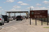 Cars wait to enter Fort Bliss in El Paso, Texas.