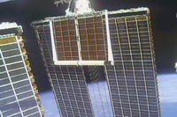 solar panel is unfolded at the International Space Station