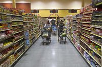 Service members and civilians shop for food