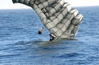 Navy SEAL completes a water jump.