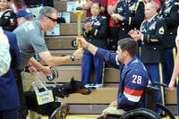 Torch is passed during opening ceremony of 2014 Warrior Games.