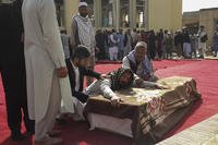 Funeral ceremony for victims of a suicide attack in Afghanistan