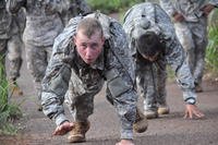 Soldiers bear-crawl during a physical readiness training competition.