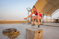 Special Forces master sergeant performs a box jump.