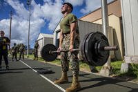 A Marine performs a deadlift.