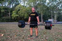 An Army major executes a deadlift.