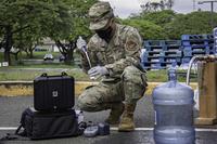 Airman completes the daily pH, chlorine and bacteria tests on water
