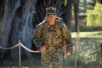 A service member takes a ruck-march test.