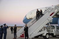 Second gentleman Doug Emhoff, left, and Vice President Kamala Harris exit Air Force Two.