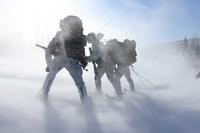 Green Berets load into a helicopter during Exercise ARCTIC EDGE 2022 in Alaska.