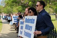 People protest the use of live animals in medical training at the Naval Medical Center Portsmouth.