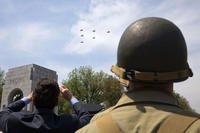 A soldier wears a World War II-era uniform at the World War II Memorial in Washington on the 70th anniversary of Victory in Europe Day (V-E Day).