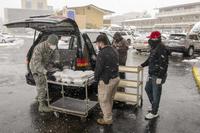233rd Space Group security forces specialist gathers meals for lunch.