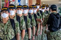 recruit chief petty officer does a mass count of his division as they prepare to march in formation