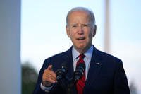 President Joe Biden speaks from the Blue Room Balcony of the White House