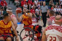Marine Corps wheelchair basketball player Carlos Cruz-Tejeda shoots against Team Canada at the Department of Defense Warrior Games near Orlando, Florida, Aug. 23, 2022.