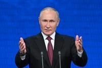 Russian President Vladimir Putin addresses an event