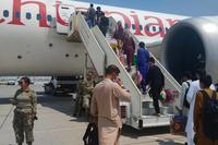 Afghan evacuees at Abdullah Al Mubarak Air Base in Kuwait City.