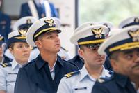 Attendees listen during an establishment ceremony to formally establish Coast Guard Base Astoria.