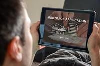 man applying for mortgage online