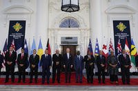 President Joe Biden, center, poses for a photo with Pacific Island leaders.