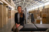 Christina Lorete, certified athletic trainer for the Headquarters and Headquarters Battalion, 4th Infantry Division, poses for a portrait on her treatment table at Fort Carson, Colorado.